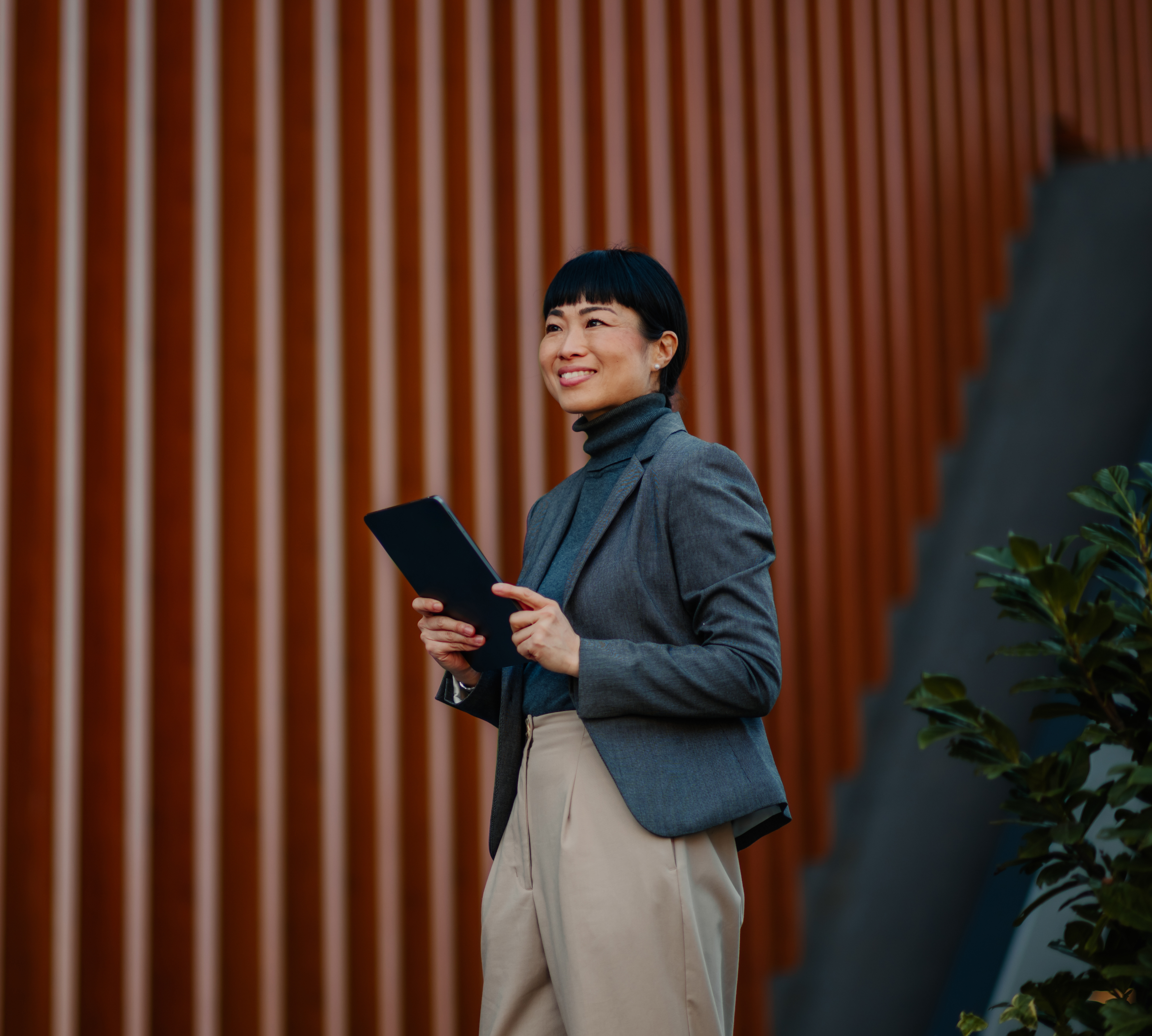 A woman with shoulder length hair and wearing an apron stands at counter, entering information into a point-of-sale terminal. Text next to the image reads, “5G Business Internet plans. High-speed internet and a network you can depend on.”